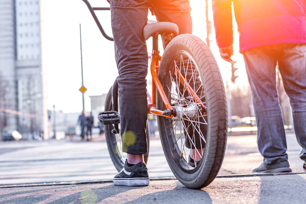 Urban biking - teenage boy riding bike in city - 写真・画像