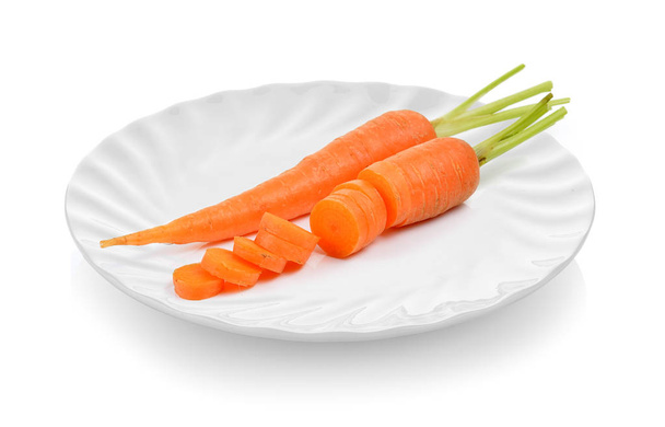  baby carrots in ceramic plate on white background - Photo, Image
