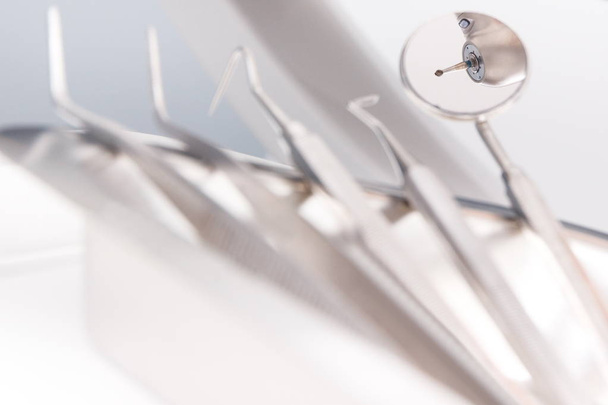 Set of dental stainless tools for using by dentists in modern stomatology office - Foto, Imagem