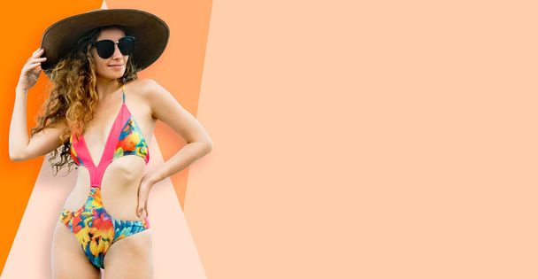 Beautiful young sexy woman in swimsuit posing on color background. Summer advertising. - Photo, Image