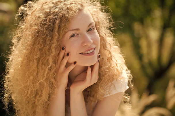 beautiful girl with curly hair. Happy woman outdoor - Φωτογραφία, εικόνα