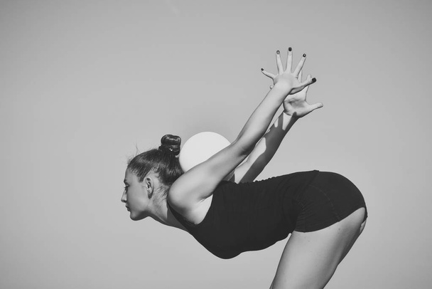 gymnastics with the ball. Gymnastic school and energy. - Foto, afbeelding
