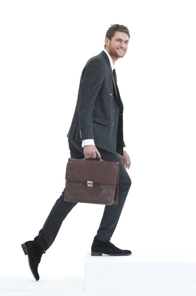 in full growth. a businessman with a leather briefcase walks up. - Fotoğraf, Görsel