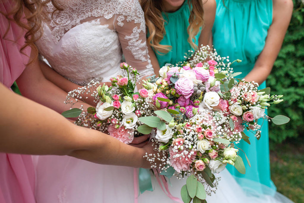 Wedding bouquet of flowers including Red hypericum, Roses, Lilies of the valley, mini Roses, Seeded Eucalyptus, Astilbe, Scabiosa, Pieris, and ivy - Fotoğraf, Görsel