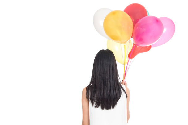 Woman holding colorful balloons isolated on white background - Фото, изображение
