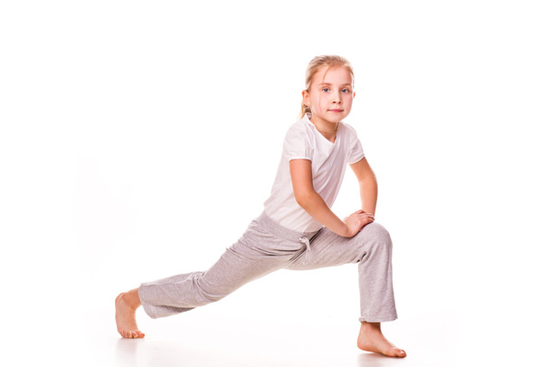 Beautiful girl gymnast exercising, stretching - Fotoğraf, Görsel