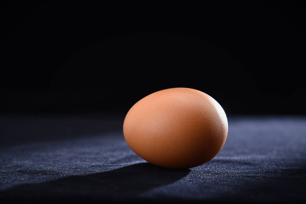 hen egg on table black background - Photo, image