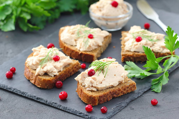 Delicious sandwiches with homemade chicken liver pate served with greens and berries - Photo, Image