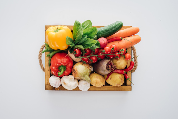 top view of box with fresh organic vegetables isolated on white  - Photo, Image