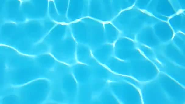 スイミングプールの水の太陽の反射背景。リップル水. - 映像、動画