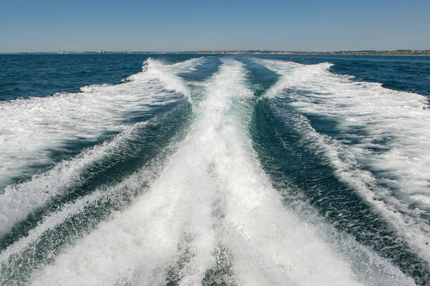 Yacht parts ropes of feed, Summer vacation at the sea , waves splashing, yacht track - Photo, Image