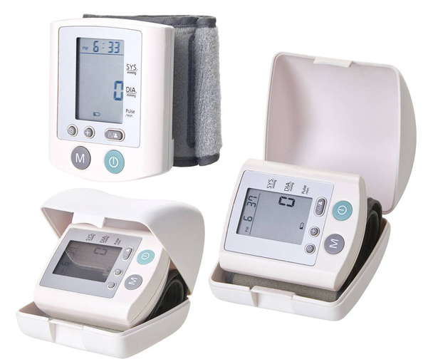 Portable digital blood pressure monitor. Wrist tonometer. Isolated on white background. Blood Pressure Monitor on white background. Medical equipment. Tonometer - Photo, Image