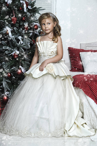 little girl in white dress with christmas decorations - Zdjęcie, obraz