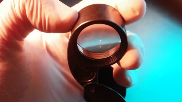 Close up of a magnifying loupe lens - Footage, Video