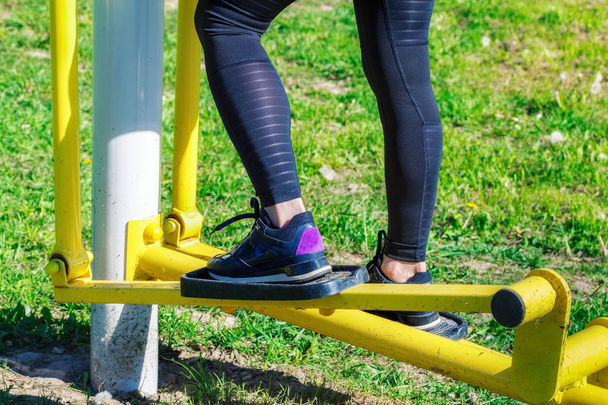 Woman using stepper training machine at outdoor - Photo, Image