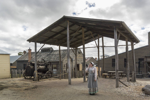 A lady in traditional costume in Sovereign Hill, an open air museum in Golden Point, a suburb of Ballarat, Victoria, Australia. Sovereign Hill depicts Ballarat's first ten years after the discovery of gold there in 1851. - Photo, Image