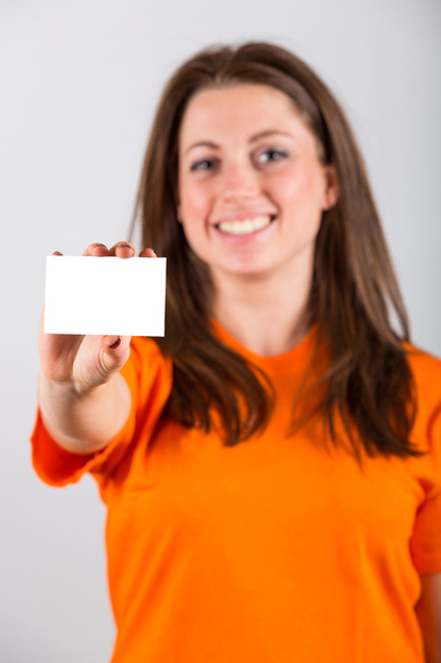 Young Woman Holding Blank Card - Foto, imagen