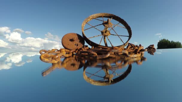 Rusty scrap-iron heap on mirror and clouds motion, time lapse - Footage, Video