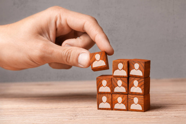 Building team. The leader builds  team from cubes with employees - Photo, image