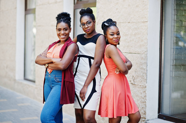 Three stylish african american womans posed at sunny summer day outdoor. - Foto, Imagen