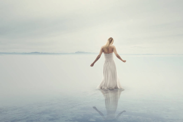 beautiful woman vanishing in the water - Foto, Bild