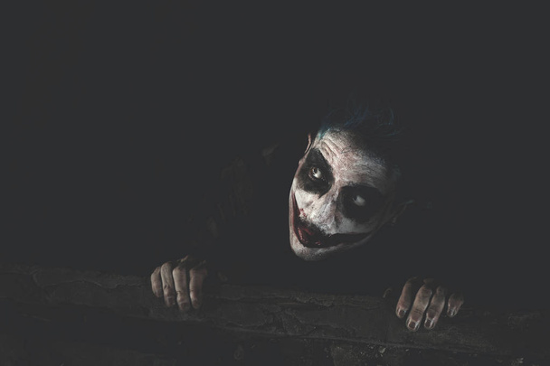creepy clown hiding in the dark - Photo, Image