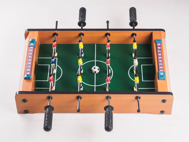 Mini table football foosball soccer with players and ball. isolated. - Photo, Image