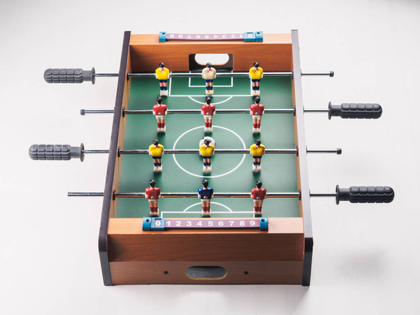 Mini table football foosball soccer with players and ball. isolated. - Foto, Bild