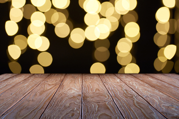 empty wooden surface and beautiful yellow bokeh background - Photo, Image