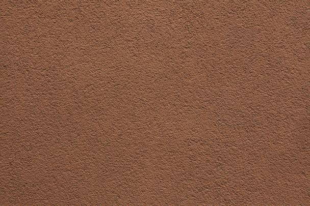 Brown painted stucco wall. Background texture. - Foto, afbeelding
