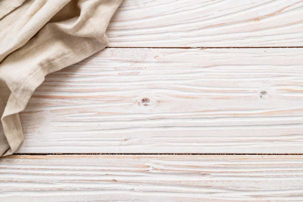 kitchen cloth (napkin) on wood background - Fotó, kép