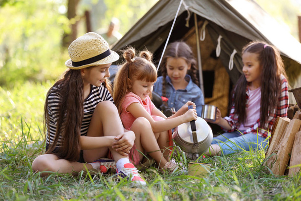 Little children near tent outdoors. Summer camp - Fotografie, Obrázek