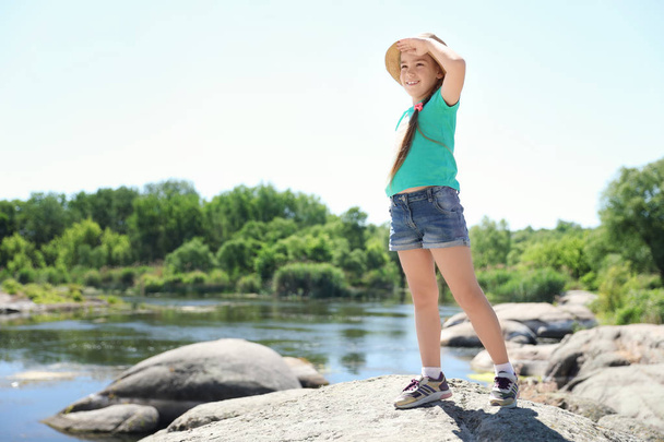 Little girl at riverside. Summer camp - Valokuva, kuva