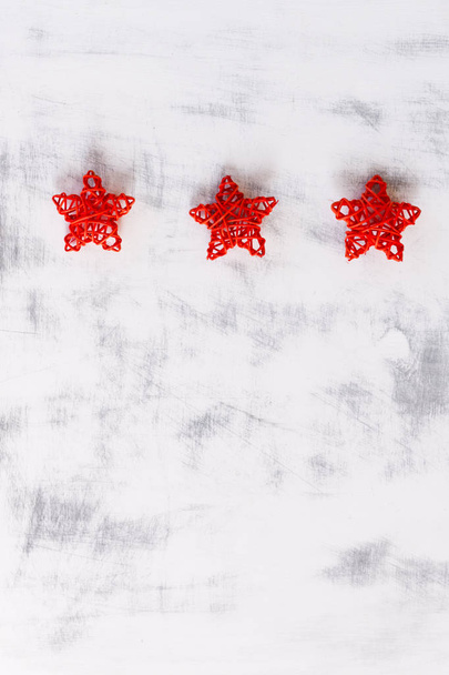 Christmas background. Three red handmade stars on white vintage background. Copy space. - Photo, Image
