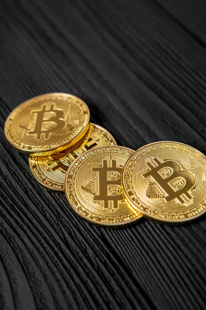 electronic crypto currency, gold bitcoin on wooden table  - Foto, Imagem