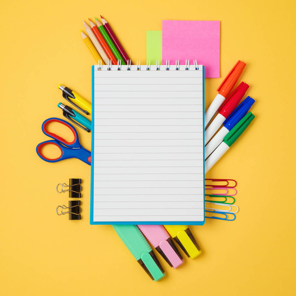Back to school background with notebook and school supplies. View from above - Фото, изображение