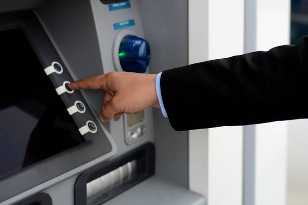 Business man put his credit card at the ATM  - Fotoğraf, Görsel