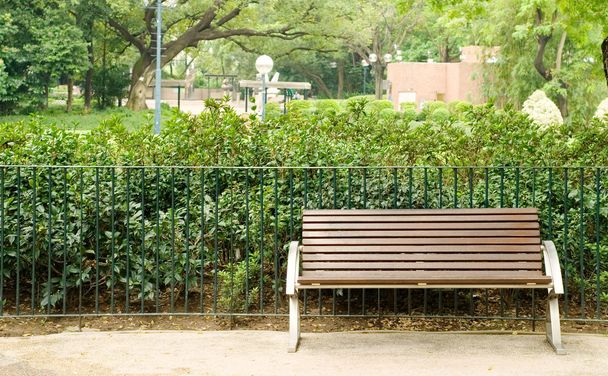 Brown bench with nobody in the park - Photo, Image