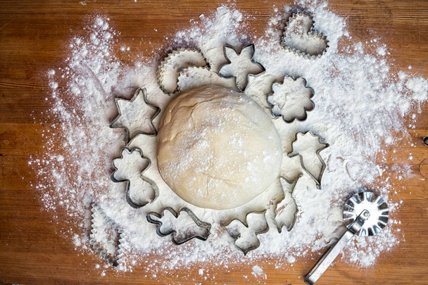 forms for squeezing the dough. dough on the table with dough tools. - Photo, Image