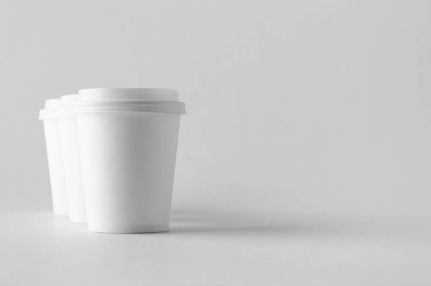 8 oz. white coffee paper cup mock-up with lid. - 写真・画像