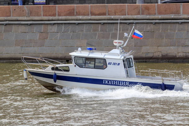 Moscow, Russia - June 21, 2018: Police boat rushing on Moskva river in historical center of Moscow on a summer day - Photo, image