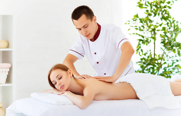 beautiful girl enjoys massage and spa treatments - Zdjęcie, obraz