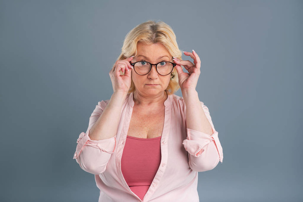 Pleasant senior woman trying on new eyeglasses - Φωτογραφία, εικόνα