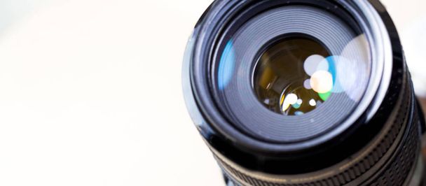 Camera lens with bokeh lights background, banner for website. - Photo, Image