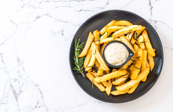 french fries with sauce - unhealthy food - Foto, immagini