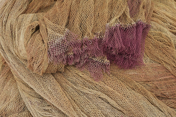 a heap of brown with purple fishing nets                                - Photo, Image