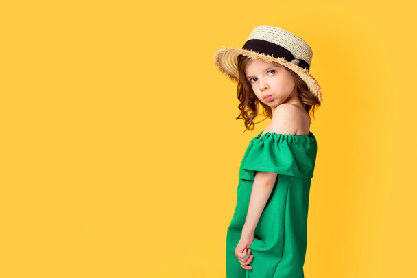 little girl in dress and hat in studio - Фото, зображення