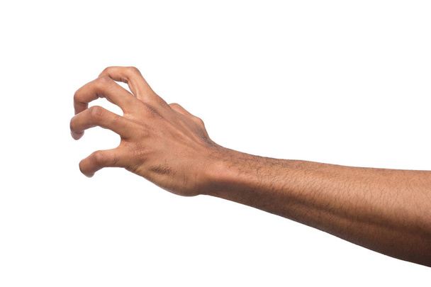 Zwarte mannenhand oppakken van iets, knipsel - Foto, afbeelding