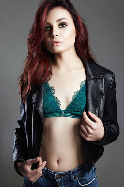 Fashion portrait of Young woman. Beautiful Girl in leather jacket and underwear. Trendy Dyed Hair color and Make-up sexy model - Photo, image