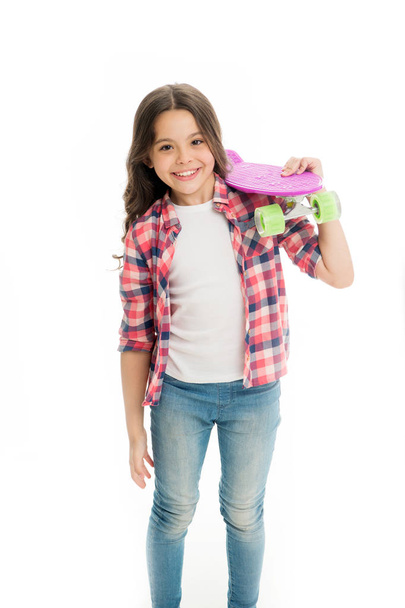Little child smile with penny board isolated on white. Happy skater girl. Ready to ride. Hipster child is active in summer. Skateboarding is way of life. Active hobby and sport activity - Fotó, kép